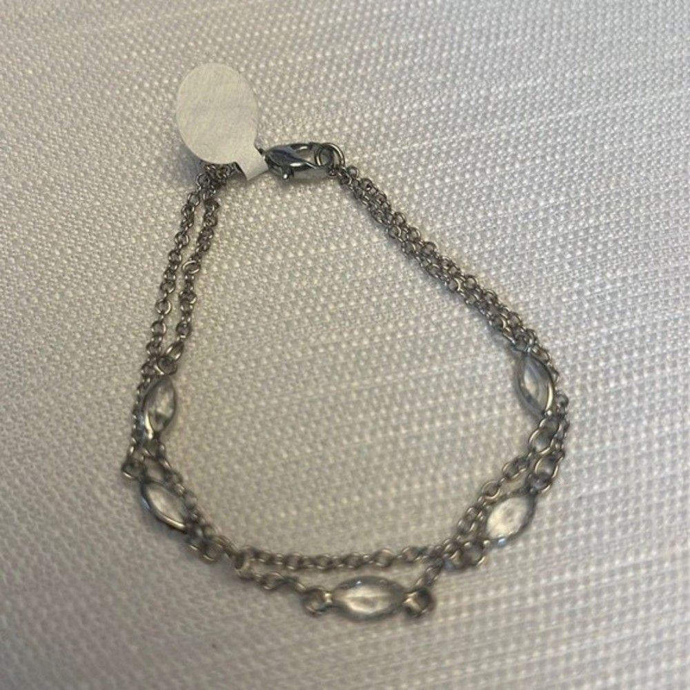 Handcrafted silver tone bracelet with clear stone detail